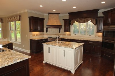 6-Stained cherry cabinetry with white middle island