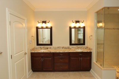 8-Double vanities in master bath with custom glassed shower
