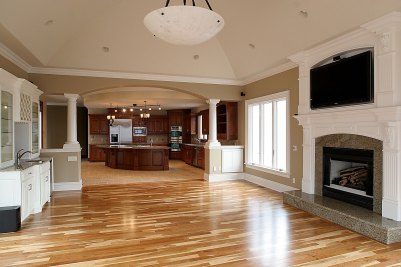 13-Gathering Room with wetbar and fireplace featuring arched & vaulted ceiling to center.