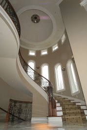 3-Custom dome built on-site above curved stairway to 2nd floor.