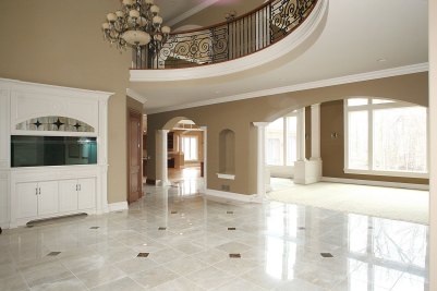 5-Marble tile entry foyer with custom built aquarium (Left) and Great Room beyond4-Second floor overlook to entry foyer