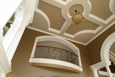 9-Second floor overlook to Great Room below with architectural ceiling design above.