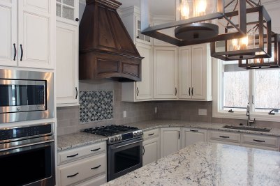 7-Stained decorative wood hood with white cabinetry