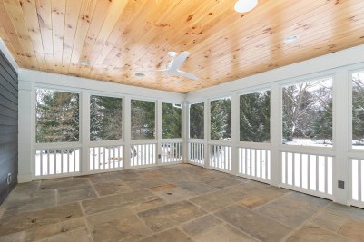 6-Rear Screened Porch with knotty pine ceiling and natural Bluestone floor