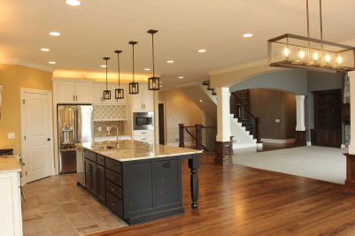 6-Kitchen with stained island, select Hickory hardwood & Florida Tile in Earthstone Seal color
