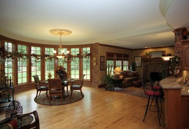 12-Rounded breakfast room with maple flooring