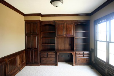 10-Study with stained maple wainscote and custom built-in cabinetry.