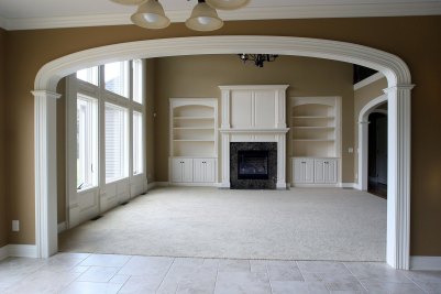 9-Great Room entry from Kitchen with fireplace and built-in custom cabinetry by Cabinet Specialties Co. each side.