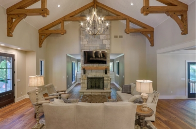 2-Great Room timber framed trusses and natural stone fireplace