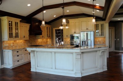 4-Stained wood beams in kitchen with glazed cabinetry