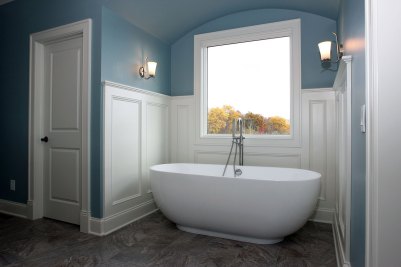 9-Paneled wainscoting in master bath with freestanding tub