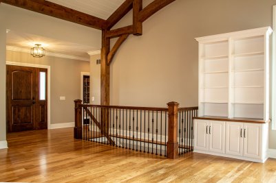 7-Stairway to lower level with hammered wrought iron balusters